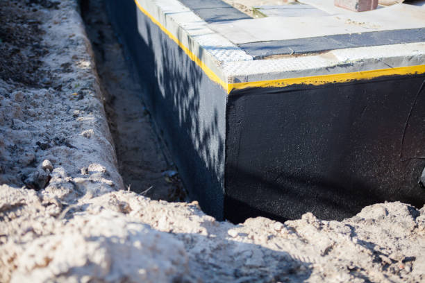 Professional Waterproofing technician working in Breckenridge, MI